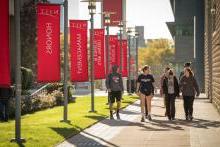 College students walking outside on campus